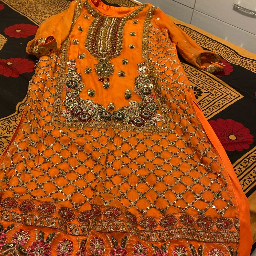 A orange color Indian dress ...